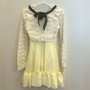 Weissman dance dress. Color: ivory w/ black bow. Sz. SC (small child)